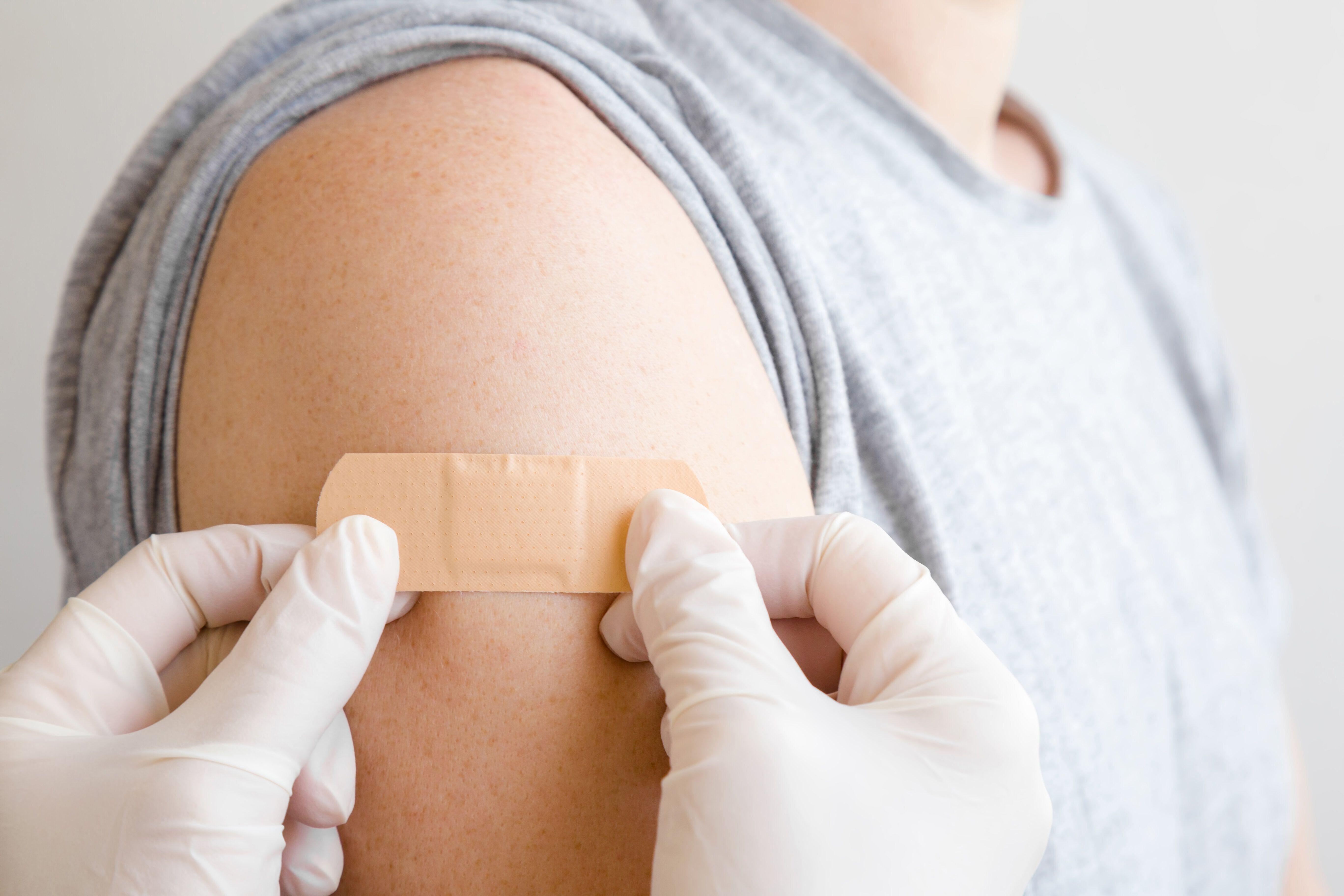 an image of a person getting vaccination for hpv men